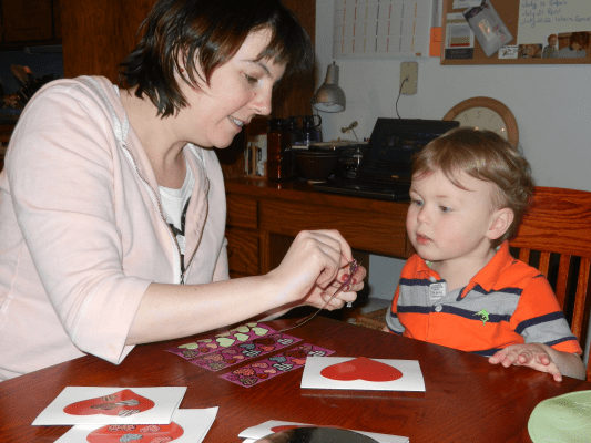 Peeling stickers off the sheet